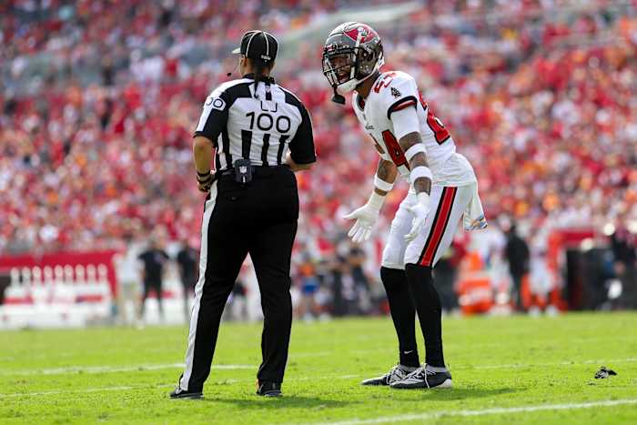 Oct 22, 2023; Tampa, Florida, USA; Tampa Bay Buccaneers cornerback Carlton Davis III (24) talks to line judge Maia Chaka (100) after a play against the Atlanta Falcon in the third quarter at Raymond James Stadium. Mandatory Credit: Nathan Ray Seebeck-USA TODAY Sports